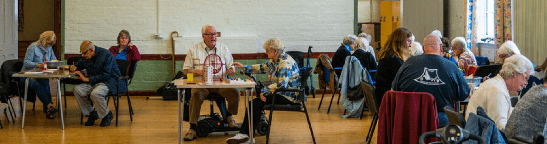 Group of people in hall playing bingo